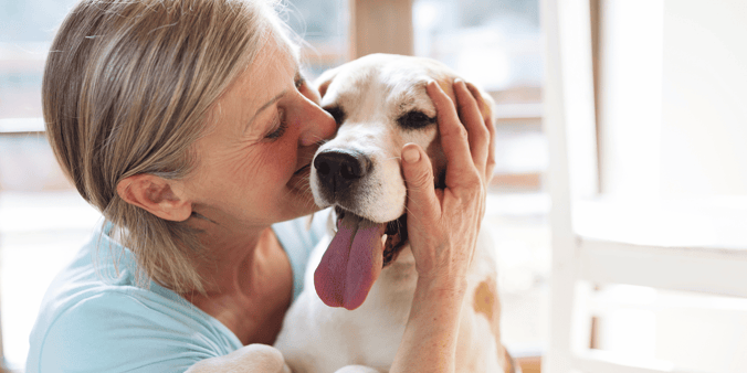Woman hugging dog