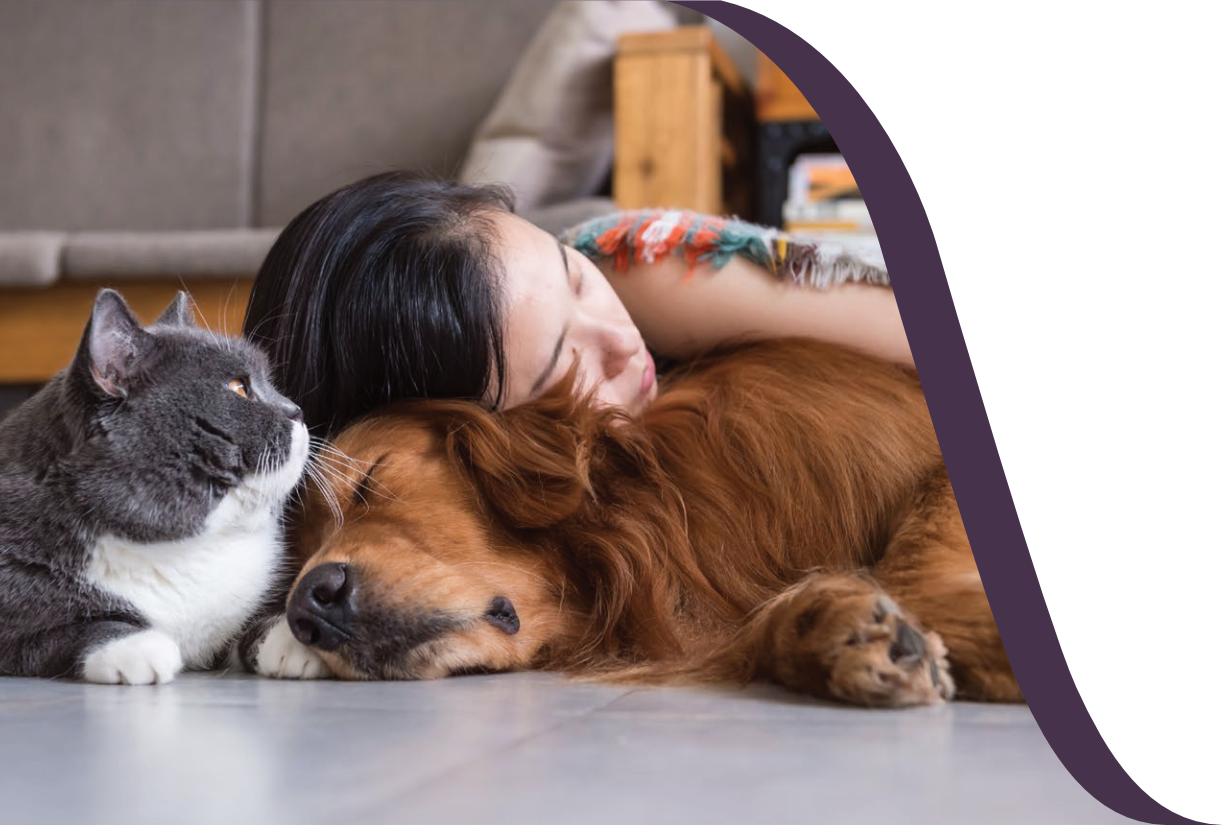Woman with two pets snuggling